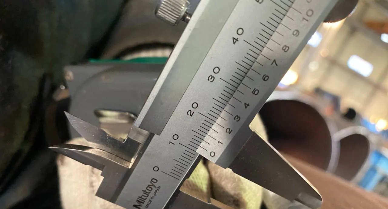 Inspection measurement with caliper
